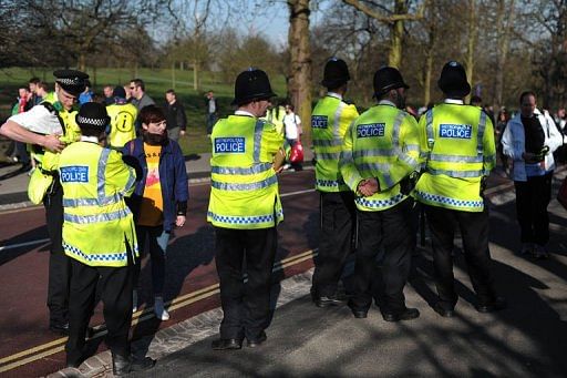 Police officers patrol in Greenwich Park in southeast London on April 21, 2013 ahead of the 2013 London Marathon