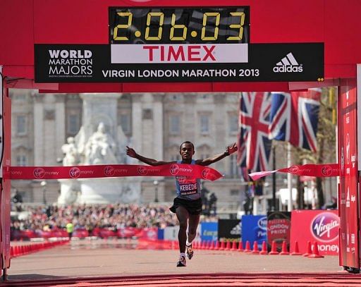 Tsegaye Kebede of Ethiopia crosses the finish line in central London on April 21, 2013