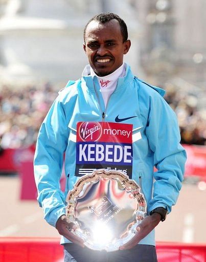 Tsegaye Kebede of Ethiopia poses for a picture with his shield on the Mall in London on April 21, 2013