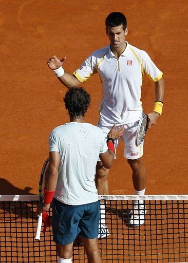 Novak Djokovic and Rafael Nadal shake hands after the final of the Monte Carlo Masters on April 21, 2013