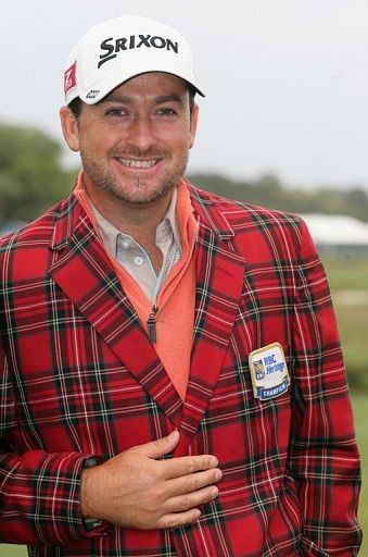 Graeme McDowell of Northern Ireland smiles after winning the RBC Heritage on April 21, 2013