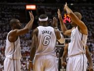 LeBron James is congratulated by Dwyane Wade (L) and Shane Battier on April 21, 2013