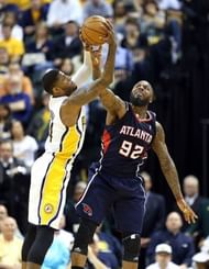 Paul George (L) of the Indiana Pacers and DeShawn Stevenson of the Atlanta Hawks reach for a loose ball on April 21, 2013