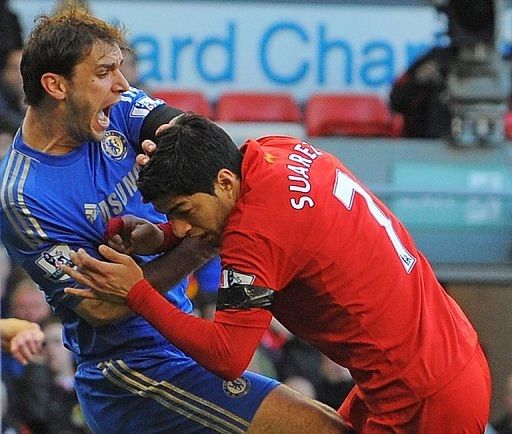 Luis Suarez (R) and Branislav Ivanovic at the Liverpool v Chelsea game in Liverpool on April 21, 2013