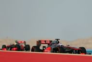 McLaren's Sergio Perez (left) and Jenson Button drive in Manama on April 21, 2013 during the Bahrain F1 Grand Prix