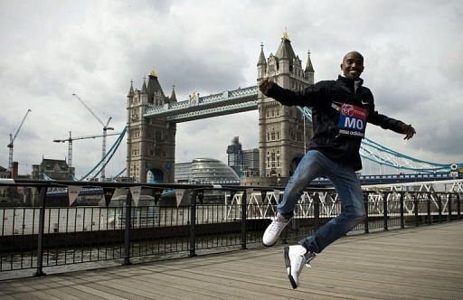 British Olympic champion Mo Farah jumps in front of London&#039;s Tower Bridge on April 22, 2013