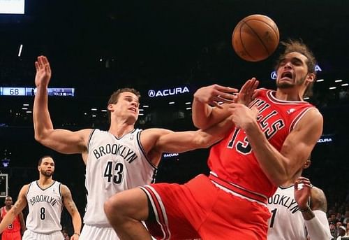 Kris Humphries of the Brooklyn Nets blocks a shot by Joakim Noah of the Chicago Bulls on April 22, 2013