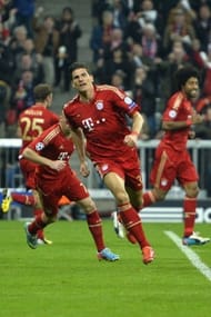 Bayern Munich's striker Mario Gomez (C) celebrates scoring against Barcelona on April 23, 2013 in Munich