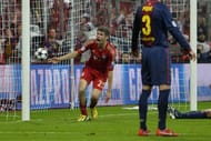 Bayern's Thomas Mueller (L) reacts after scoring the fourth goal in Munich on April 23, 2013