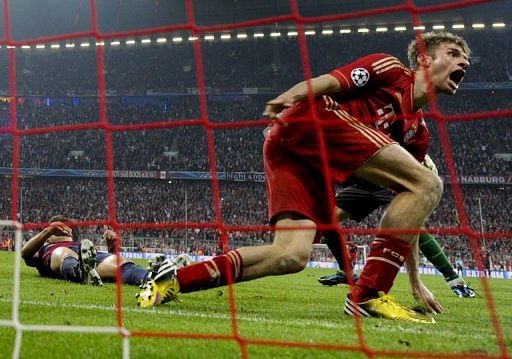 Thomas Mueller scores the fourth goal in the 4-0 hammering of Barcelona in the UEFA Champions League on April 23, 2013