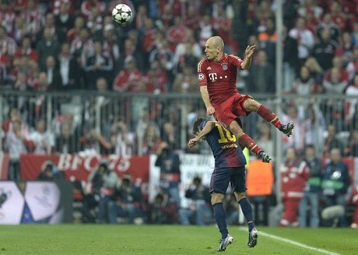 Bayern Munich winger Arjen Robben rises above Barcelona&#039;s Jordi Alba on April 23, 2013