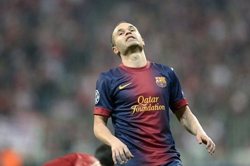 Barcelona midfielder Andres Iniesta reacts during the UEFA Champions League semi-final first leg on April 23, 2013