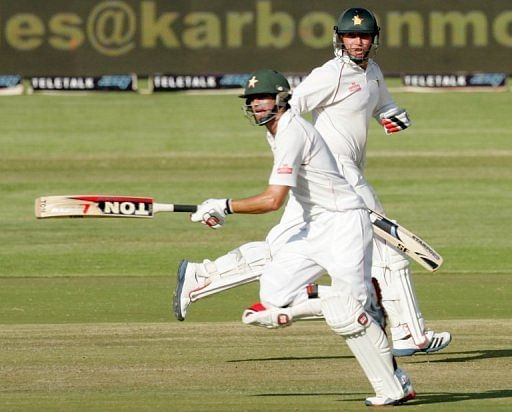 Zimbabwe&#039;s Brendan Taylor (R) and Graeme Creamer are pictured during the first Zimbabwe test on  April 19, 2013