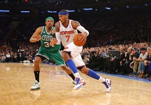 NY Knicks' Carmelo Anthony (R) drives past Boston Celtics' Paul Pierce during their game in New York on April 23, 2013