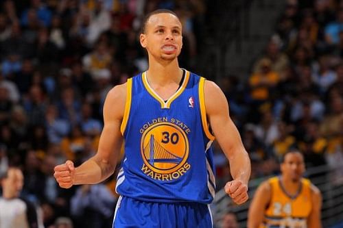 Stephen Curry of the Golden State Warriors celebrates a play against the Denver Nuggets on April 23, 2013