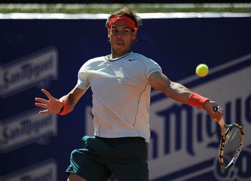Spanish player Rafael Nadal returns a ball to Argentinian player Carlos Berlocq in Barcelona on April 24, 2013