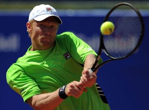 Russian player Dmitry Tursunov returns a ball to Spanish player David Ferrer in Barcelona on April 24, 2013