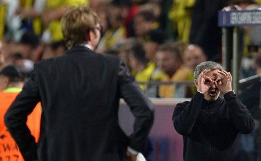 Dortmund&#039;s coach Juergen Klopp (L) looks on as Real Madrid&#039;s coach Jose Mourinho gestures on April 24, 2013 in Dortmund