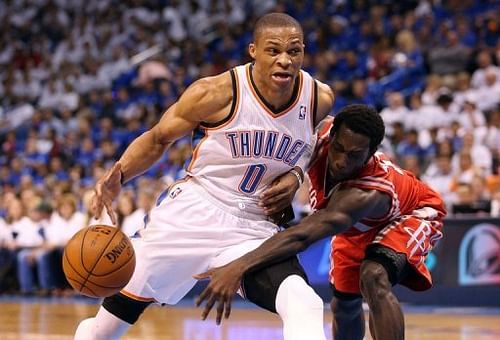 The Thunder's Russell Westbrook (L) is guarded by Houston Rockets' Patrick Beverley during their game on April 24, 2013