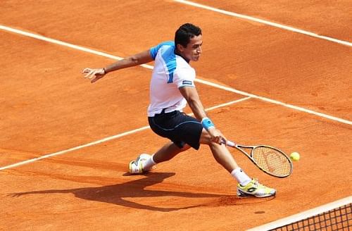 Spain's Nicolas Almagro hits a return during a match, on April 17, 2013, in Monaco
