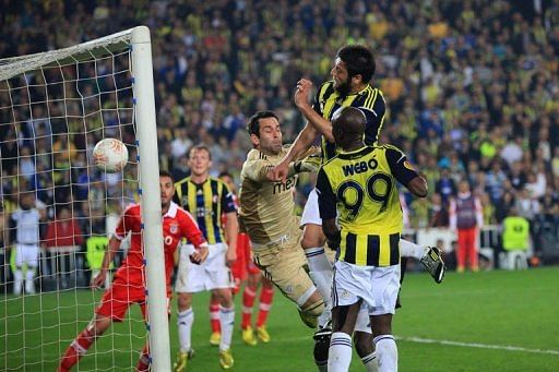 Fenerbahce&#039;s Egemen Korkmaz (2ndR) heads and scores on April 25, 2013 in Istanbul