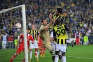 Fenerbahce's Egemen Korkmaz (2ndR) heads and scores on April 25, 2013 in Istanbul