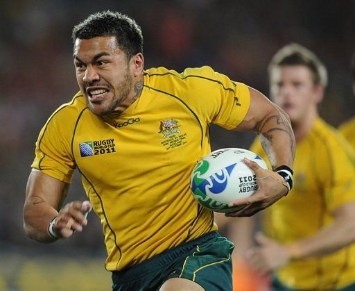 Wallabies&#039; Digby Ioane runs with the ball during a 2011 Rugby World Cup match in Auckland, on October 21, 2011
