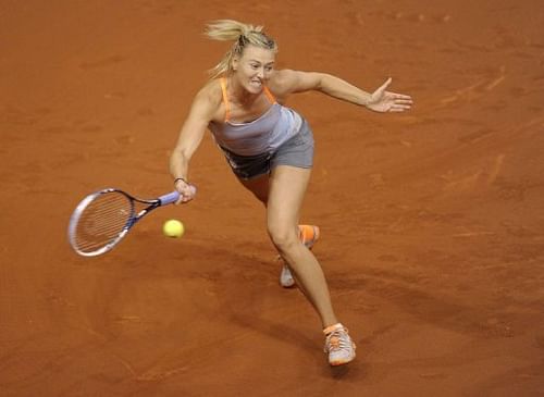 Russia's Maria Sharapova returns the ball to Serbia's Ana Ivanovic in Stuttgart, April 26, 2013