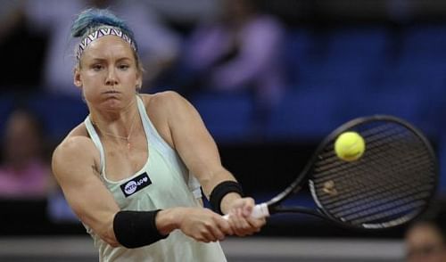 Bethanie Mattek-Sands of the USA returns the ball to Germany's Sabine Lisicki in Stuttgart, April 26, 2013