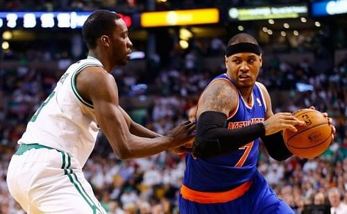 Carmelo Anthony (R) of the New York Knicks drives to the basket on April 26, 2013