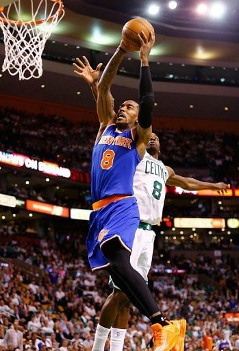 J.R. Smith of the New York Knicks dunks the ball over Jeff Green of the Boston Celtics on April 26, 2013
