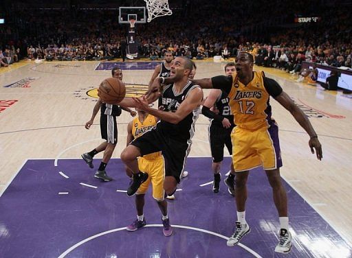 Tony Parker of the San Antonio Spurs drives to the basket past Dwight Howard of the Los Angeles Lakers, on April 26, 2013