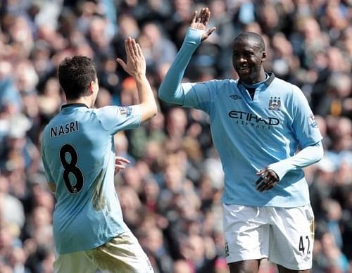Manchester City's Yaya Toure (R) celebrates his goal against West Ham with Samir Nasri in Manchester, April 27, 2013 Manchester City's Yaya Toure (R) celebrates his goal against West Ham with Samir Nasri in Manchester, April 27, 2013