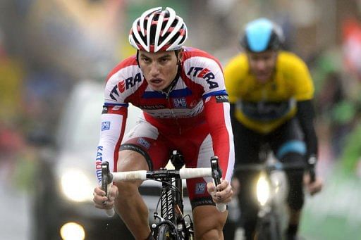 Slovenia&#039;s Simon Spilak (L) wins the fourth stage of the Tour de Romandie cycling race on April 27, 2013