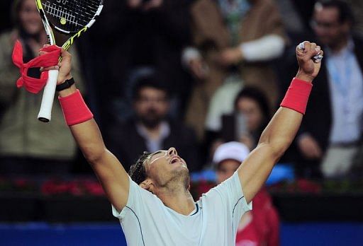 Spanish player Rafael Nadal celebrates his victory in Barcelona on April 27, 2013