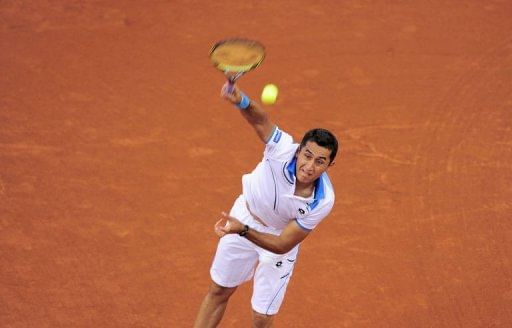 Spanish player Nicolas Almagro serves against German player Philipp Kohlschreiber in Barcelona on April 27, 2013