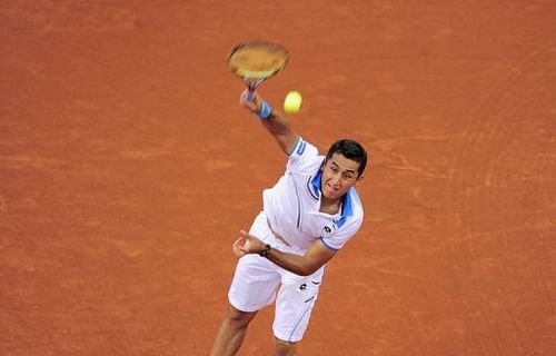 Spanish player Nicolas Almagro serves against German player Philipp Kohlschreiber in Barcelona on April 27, 2013