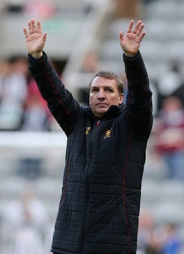 Liverpool manager Brendan Rodgers gestures to fans after the 6-0 thrashing of Newcastle United on April 27, 2013