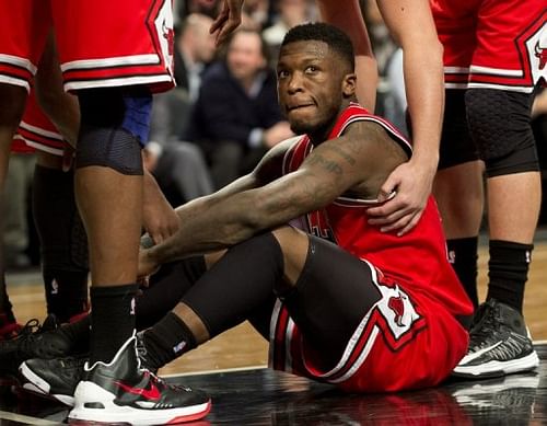 Chicago Bulls' Nate Robinson sits on the court while playing the Brooklyn Nets on April 22, 2013