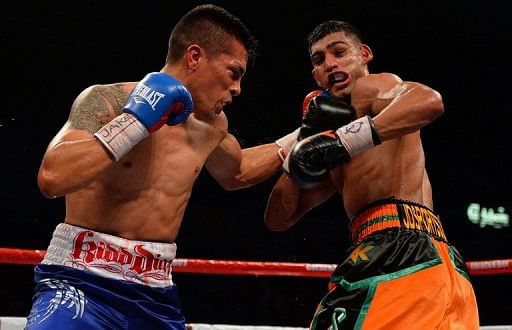 Julio Diaz lands a clubbing left-hander to the jaw of Amir Khan on April 27, 2013 in Sheffield