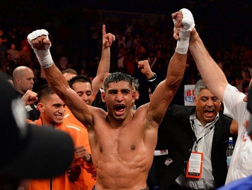 Amir Khan reacts to defeating Julio Diaz in Sheffield on April 27, 2013
