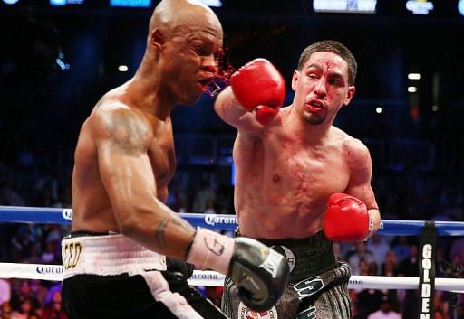 Danny Garcia catches Zab Judah with a punishing right-hander on April 27, 2013 in New York
