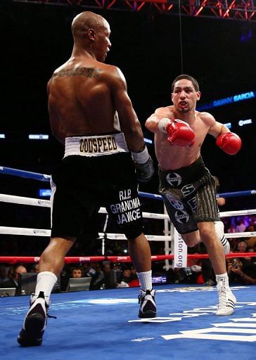Danny Garcia takes a swing at Zab Judah during their title fight on April 27, 2013