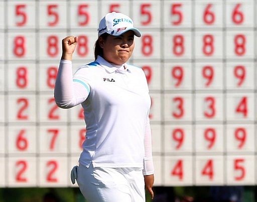 Park In-Bee celebrates after sinking a birdie at the final hole to win the North Texas LPGA Shootout on April 28, 2013