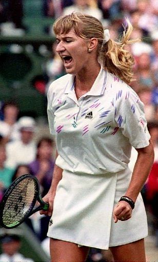 Steffi Graf yells in delight as she breaks Monica Seles&#039; service game during the Wimbledon final on July 4, 1992