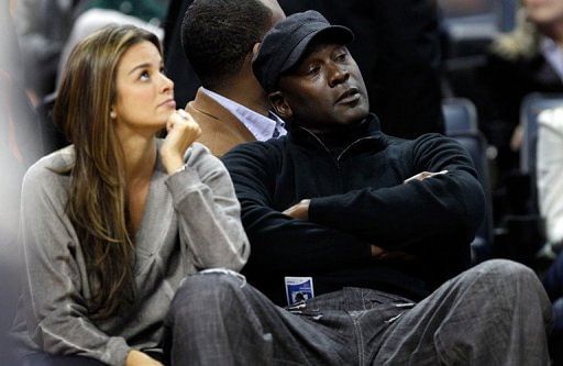 Retired NBA legend Michael Jordan sits beside Yvette Prieto during a game in February 2012 in Charlotte, North Carolina