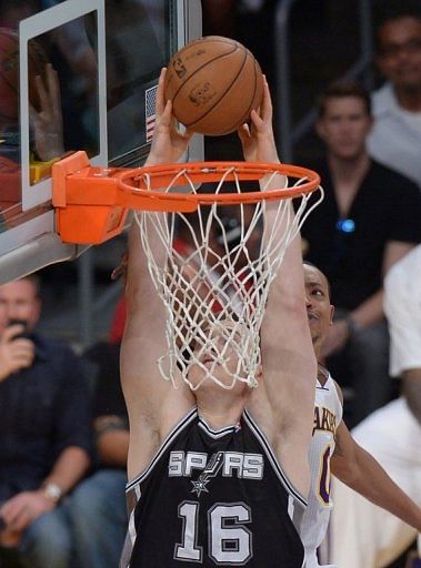Aron Baynes of the San Antonio Spurs dunks against the Los Angeles Lakers on April 28, 2013