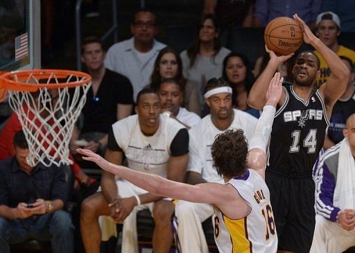 Gary Neal of the San Antonio Spurs shoots against Pau Gasol of the Los Angeles Lakers on April 28, 2013