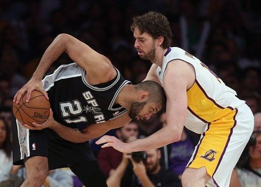 Tim Duncan of the San Antonio Spurs heads off Pau Gasol of the Los Angeles Lakers,  April 28, 2013 in Los Angeles