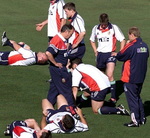 Graham Henry (C, hand on hips) conducts a training session for the British Lions in Perth on June 7, 2001